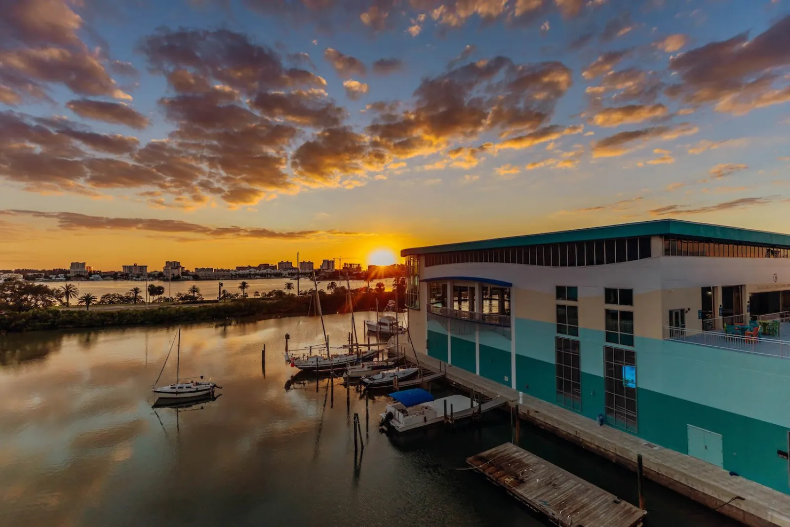 Sunset over the marina and waterfront building of Clearwater Marine Aquarium